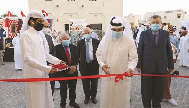 Katara general manager Dr Khalid bin Ibrahim al-Sulaiti inaugurating the exhibition yesterday as other dignitaries look on.