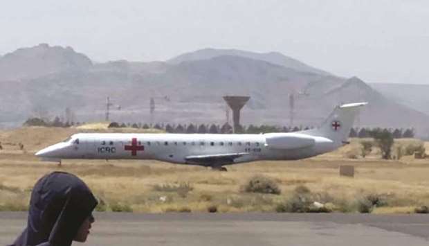 An ICRC plane carrying prisoners is seen on the tarmac of an airport in Yemenu2019s Houthi rebel-held capital Sanaa.