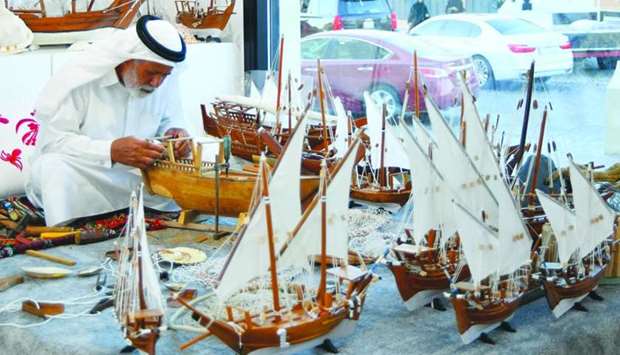 A local artisan demonstrates how to make miniature dhows. PICTURE: Ram Chand