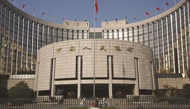 The Peopleu2019s Bank of China headquarters in Beijing. The yuan surged past a key technical level, a sign that the central bank may soon be forced to rein in further strength in the currency.
