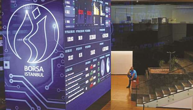 A trader talks on his phone inside the trading room of the Borsa Istanbul stock exchange in Istanbul (file). Local mom and pop investors rushed to the equity market this year to escape lacklustre returns on fixed-income assets, a trend that accelerated during the pandemic lockdown.