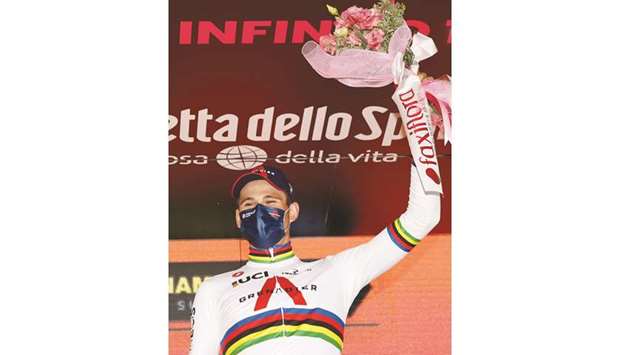 Team Ineos rider Italyu2019s Filippo Ganna celebrates on the podium of the fourteenth stage of the Giro du2019Italia 2020 race, a 34.1km individual time trial between Conegliano and Valdobbiadene yesterday. (AFP)