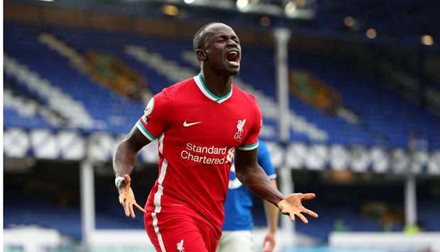 Liverpoolu2019s Sadio Mane celebrates his goal during the English Premier League match against Everton at Goodison Park in Liverpool, United Kingdom, yestaerday. (Reuters)