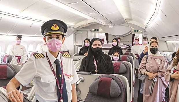 Crew and passengers on board the 'Think Pink' flight.