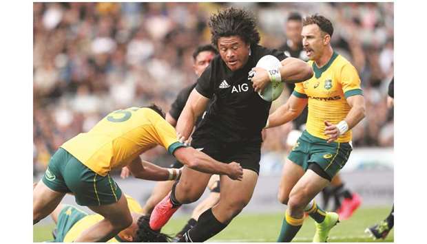 New Zealandu2019s Caleb Clarke (C) makes a break during the second Bledisloe Cup rugby union match between New Zealand and Australia in Auckland yesterday.