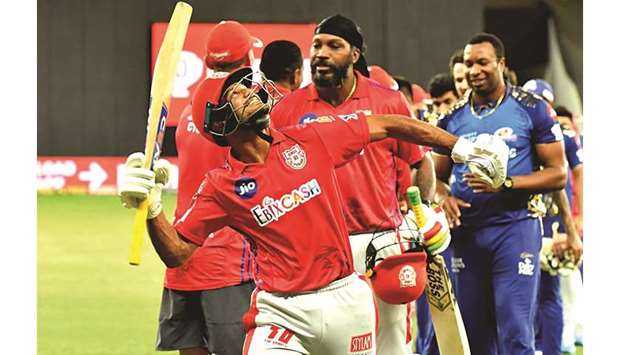 Kings XI Punjab players Mayank Agarwal (left) and Chris Gayle celebrate win over Mumbai Indians in the Indian Premier League in Dubai yesterday. (Sportzpics for BCCI)