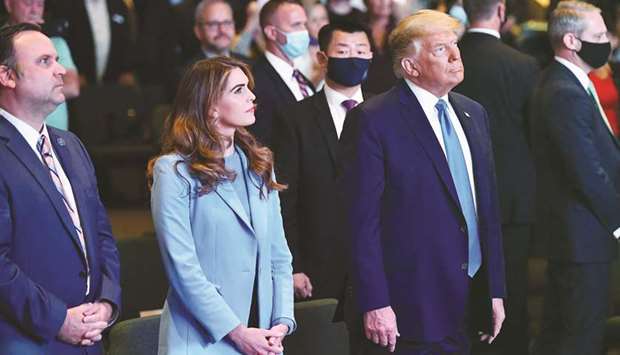 Hope Hicks, senior adviser to the president, and White House deputy chief of staff for communications Dan Scavino (left) attend services with President Donald Trump at the International Church of Las Vegas in Las Vegas, Nevada, yesterday.