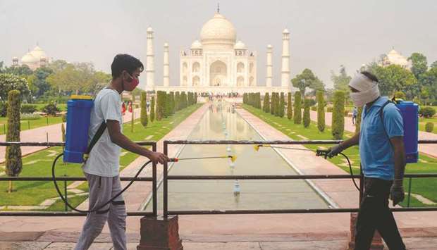 Workers sanitise the premises of Taj Mahal as a preventative measure against the Covid-19 in Agra yesterday.