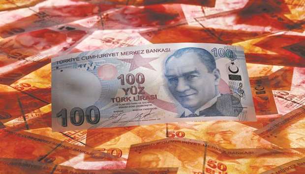 A 100 Turkish lira banknote is seen on top of 50 Turkish lira banknotes in this picture illustration in Istanbul (file). Thomas Clarke, who helps manage $56bn at William Blair International in London, said heu2019s built a long position in the lira on the grounds that the nationu2019s central bank has become more willing to tighten monetary policy.