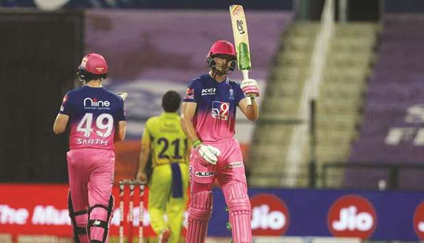 Jos Buttler (right) of Rajasthan Royals raises his bat after scoring a fifty during the Indian Premier League match against Chennai Super Kings in Abu Dhabi yesterday. (Sportzpics for BCCI)