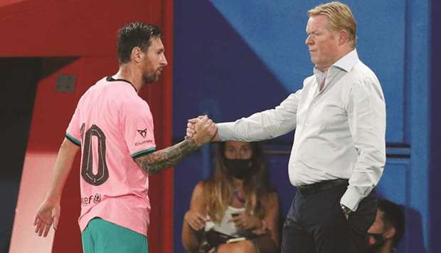 Barcelonau2019s coach Ronald Koeman (right) says captain Lionel Messi is happy to stay at the club. (Reuters)