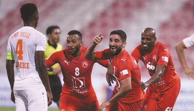 Al Arabiu2019s Mehrdad Mohammadi (centre) celebrates after scoring a last-minute winner against Umm Salal in the QNB Stars League at the Al Arabi Stadium.