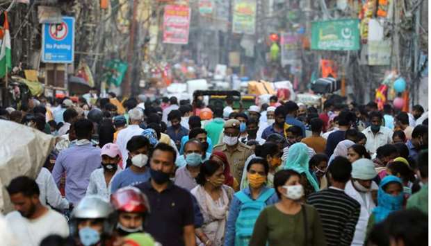 People are seen at a market amidst the spread of the coronavirus disease, in the old quarters of Delhi, India.