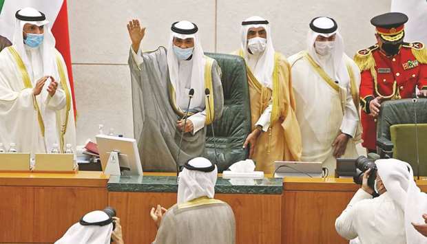 Amir of Kuwait Sheikh Nawaf al-Ahmad al-Jaber al-Sabah gestures in greeting upon arrival to attend the opening of the fifth regular session at the countryu2019s National Assembly (parliament) in Kuwait City, yesterday.