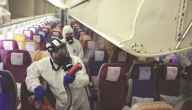 Workers in protective suits spray inside an aircraft during a disinfection process in Thailand. No travel is completely risk-free, but reliable studies have pointed to low incidence of inflight Covid-19 transmission, dispelling theories that flight cabins are highly unsafe for travel during the pandemic.