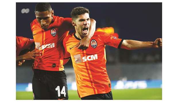 Shakhtar Donetsku2019s Manor Solomon (right) celebrates scoring their third goal with Tete during the UEFA Champions League Group B match against Real Madrid at Estadio Alfredo Di Stefano in Madrid, Spain, yesterday. (Reuters)