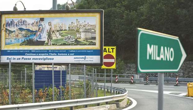 A billboard displays an advertisement for a rest area operated by Autostrade per lu2019Italia SpA, on the A7 Highway near Genoa, Italy. Stefano Patuanelli, minister for economic development, said in an interview in Rome that infrastructure giant Atlantia SpA, which controls Autostrade, has dragged its feet too long in implementing a July agreement to manage most of the countryu2019s highways.
