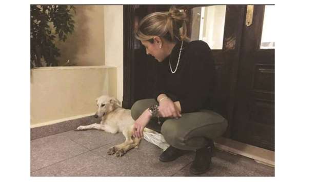 Alessandra Picchio with the dog she rescued in a paralysed condition and assisted for a year. The dog was later flown to a US sanctuary.