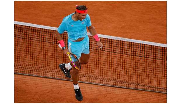 Spainu2019s Rafael Nadal celebrates his win over Italyu2019s Stefano Travaglia (not pictured) in their French Open third round match at Roland Garros in Paris, France, yesterday. (AFP)