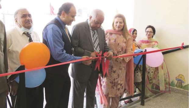 M A Shahid cutting the ribbon to inaugurate the new KG branch.