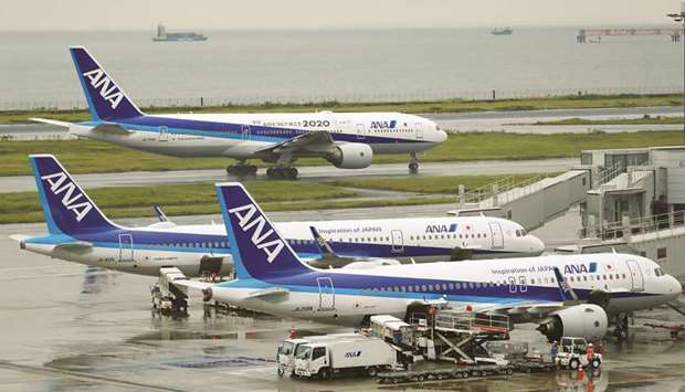 All Nippon Airways (ANA) aircraft are seen at the Tokyo International Airport yesterday. Japanu2019s government is in no mood for a huge bailout plan for ANA, sources say, preferring a piecemeal approach to direct capital injections u2013 a stark contrast to the bold moves other countries have made to protect flagship carriers.