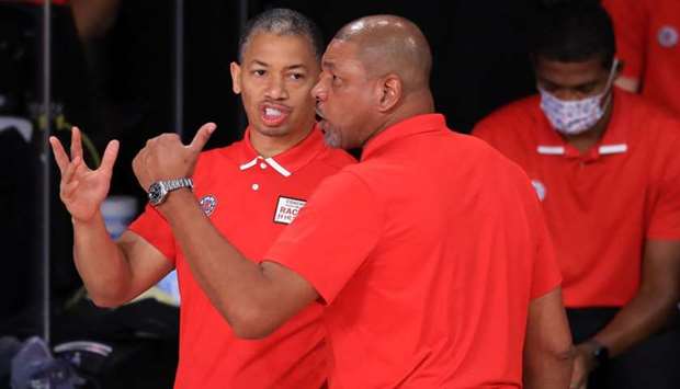 Tyronn Lue (left) with Doc Rivers.