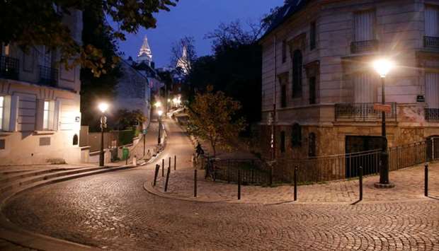 Empty streets are seen in Montmartre few minutes before the late-night curfew due to restrictions against the spread of the coronavirus disease in Paris