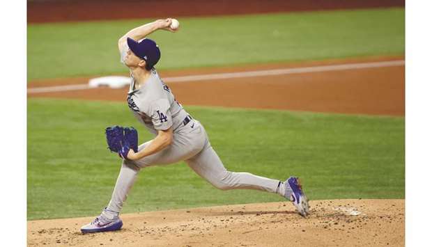 Los Angeles Dodgers starting pitcher Walker Buehler throws against the Tampa Bay Rays during the first inning of game three of the 2020 World Series at Globe Life Field in  Arlington, Texas, USA. (USA TODAY Sports)