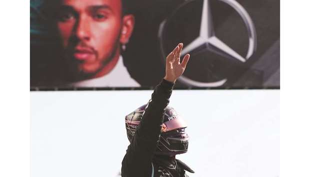 Mercedesu2019 British driver Lewis Hamilton waves to spectators after taking the pole position at the Autodromo Internacional do Algarve in Portimao yesterday.