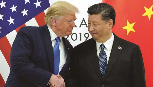 IN THE SHADOWS: President Donald Trump (left) with his Chinese counterpart Xi Jinping. Chinau2019s economy in 2021 is going to be 10% bigger than it was in 2019, and every other major economy is going to be smaller,u201d says Nicholas Lardy, an economist with the Peterson Institute for International Economics.