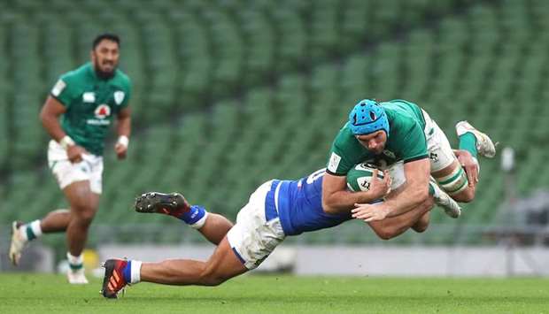 Italyu2019s Gianmarco Lucchesi (centre) tackle Irelandu2019s Tadhg Beirne during their Six Nations Championship match at the Aviva Stadium in Dublin, Ireland, yesterday. (Reuters)