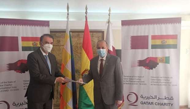 The Charge d'Affairs of the Embassy of the Bolivia in the Republic of Peru Luis Fernando Peredo Rojas  receives the aid from HE Ambassador Ali bin Hamad Al Sulaiti