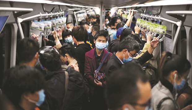 Passengers wearing face masks ride the subway in Beijing on October 23. Only China and India saw gains in household wealth in the first half of the year, growing by 4.4% and 1.6%, respectively. Latin America suffered the most, with a 13% plunge, as currency devaluations aggravated losses in gross domestic product.