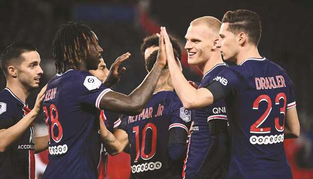Paris Saint-Germainu2019s Italian forward Moise Kean (2nd-L) celebrates with his teammates after scoring against Dijon at the Parc de Princes stadium in Paris on Saturday.