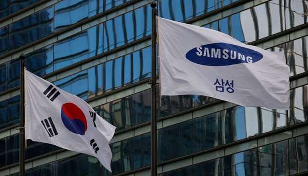 A flag bearing the logo of Samsung flutters in front of its office building in Seoul, South Korea