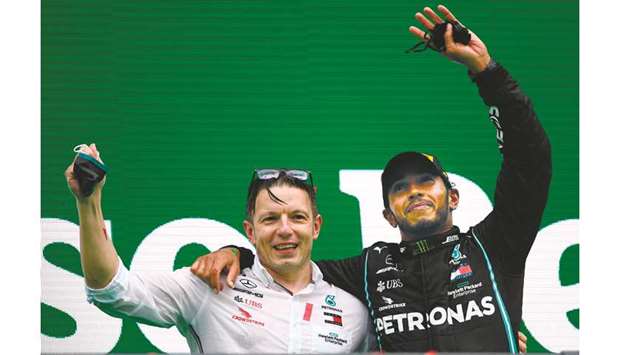 Mercedesu2019 British driver Lewis Hamilton (R) celebrates his victory with his team race engineer Peter Bonnington after the Portuguese Grand Prix at the Autodromo  Internacional do Algarve in Portimao on Sunday.