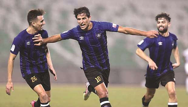 Al Sailiyau2019s Mohanad Ali (centre) celebrates after scoring against Al Gharafa in the QNB Stars League at the Al Ahli Stadium yesterday.