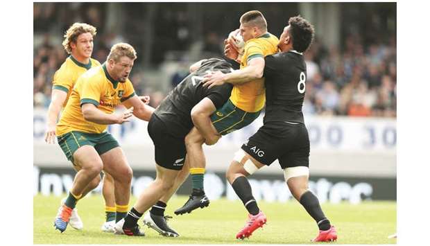New Zealandu2019s Ardie Savea (right) and Dane Coles (centre) tackle Australia James Ou2019Connor during the second Bledisloe Cup match in Auckland on October 18, 2020. (AFP)