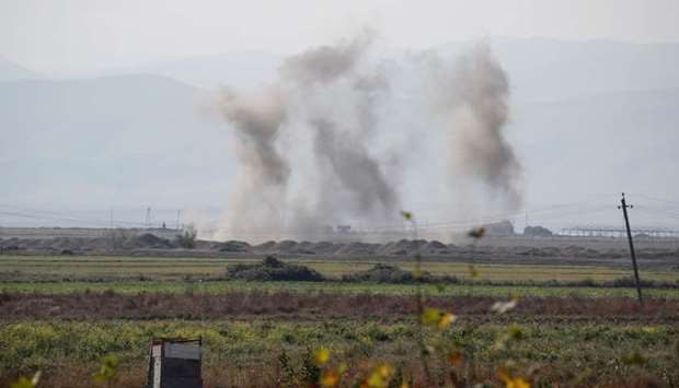 Smoke rises as targets are hit by shelling during the fighting over the breakaway region of Nagorno-Karabakh near the city of Terter, Azerbaijan October 23. REUTERS