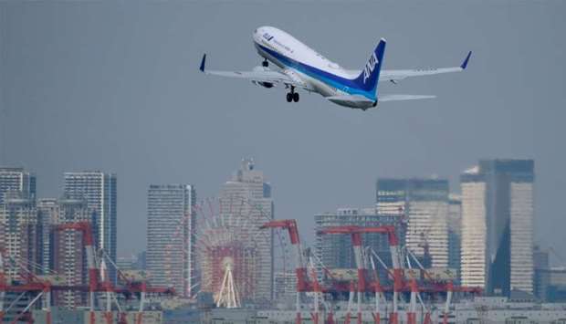 A passenger jet from Japanese carrier All Nippon Airways takes off from Tokyo's Haneda airport.