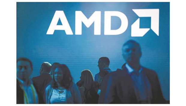 Attendees arrive ahead of an AMD launch event in San Francisco (file). The Xilinx deal, which AMD expects to close at the end of 2021, will create a combined company with 13,000 engineers and a completely outsourced manufacturing strategy that relies heavily on Taiwan Semiconductor Manufacturing Co Ltd.