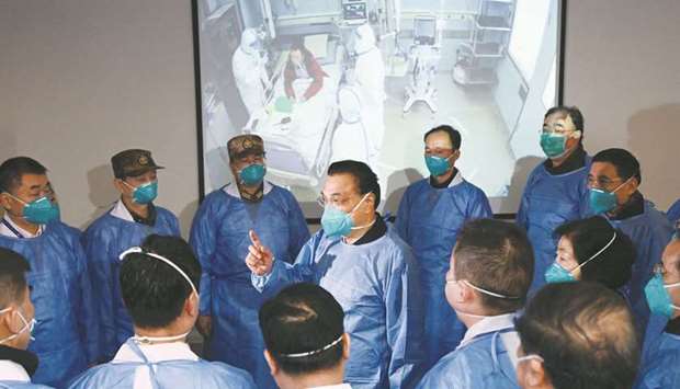ON MESSAGE: Chinese Prime Minister Li Keqiang (centre) speaking to medical workers at the Jinyintan hospital in Wuhan. (Reuters file photo)