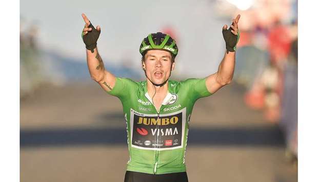 Team Jumbou2019s Slovenian rider Primoz Roglic celebrates as he crosses the finish-line of the 8th stage of the 2020 La Vuelta cycling tour of Spain, a 164km race from Logrono to Alto de Moncalvillo, yesterday. (AFP)