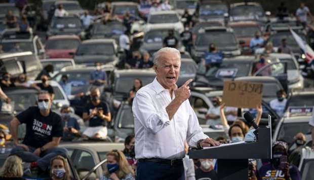 Democratic presidential nominee Joe Biden speaks during a drive-in campaign rally in the parking lot of Cellairis Ampitheatre in Atlanta, Georgia