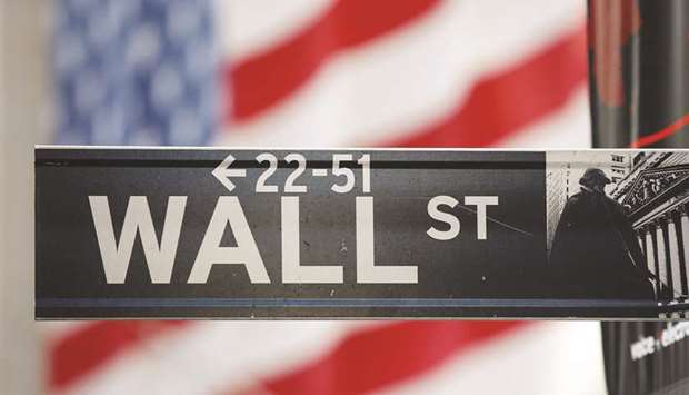 A sign for the Wall Street is seen with a giant American flag in the background across from the New York Stock Exchange (file). The US Securities and Exchange Commission mandated the creation of market-wide circuit breakers to prevent a repeat of the October 19, 1987, market crash, when the Dow plunged 22.6%.