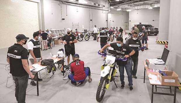 Competitors prepare their bikes on the eve of the fourth round of the Qatar National Baja.