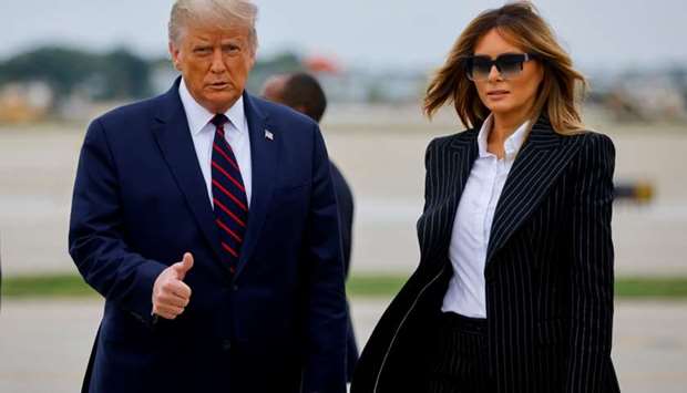 President Donald Trump walks with first lady Melania Trump at Cleveland Hopkins International Airport in Cleveland, Ohio, US., September 29