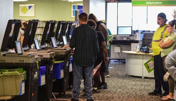 Voters cast their early ballots at the Miami Dade Regional Library in Miami, Florida
