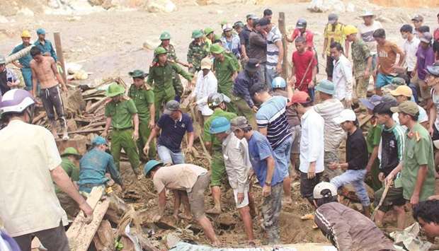 Rescue team search for victims of a landslide in Vietnamu2019s Quang Nam province.
