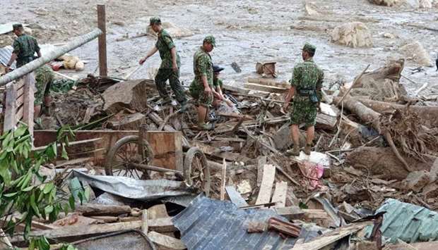 Rescue team search for victims of a landslide in Quang Nam province, Vietnam